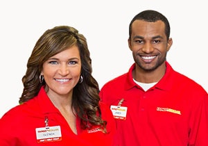 Two happy Family Dollar Associates in red Family Dollar shirts